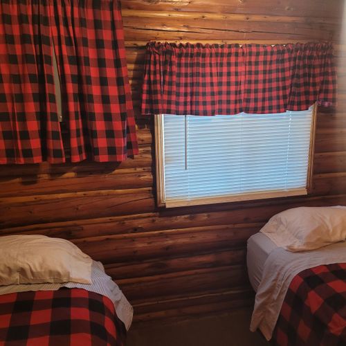 Bedroom #2:  features 2 twin size beds, nightstand, lamp, closet, and dresser
