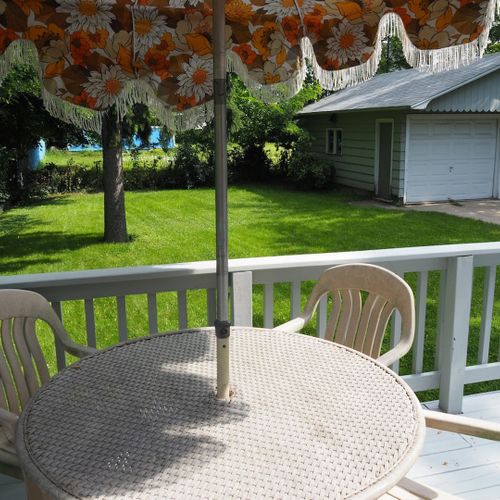 Exterior:  looking out at the beautifully green backyard lawn from the backyard deck.