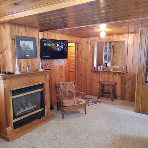 Living room:  very cozy and comfy living room with two sofas, two comfy chairs, a coffee table, and a gas fireplace.