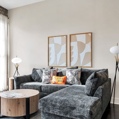 Sink into the plush sofa w/ warm natural light filling the living room.