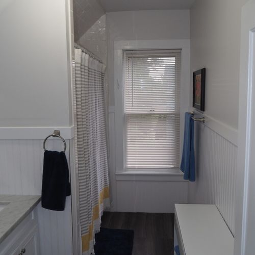 Bathroom #2 (upstairs):  there is a full bathroom upstairs with a combination bathtub / shower, toilet, vanity, sink, and mirror.