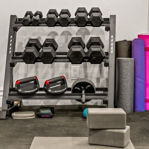 Sleek gym with mats and weights—work out anytime.