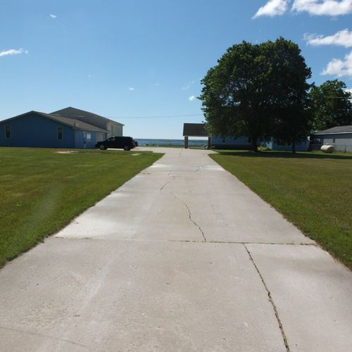 Exterior:  a good overview of the entire property with the house on the right (behind the maple tree) and the boat house and boat house apartment on the left.