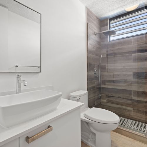 Sink into comfort and style in our immaculate washroom retreat.