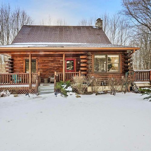 Exterior:  the front of the cabin in winter.