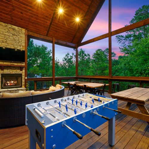 Foosball and multiple tables await on the covered deck!