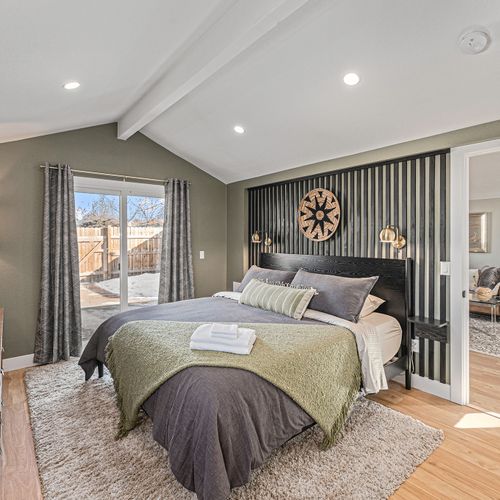 - rest easy in a plush comfortable bed with layered pillows and earthy green tones