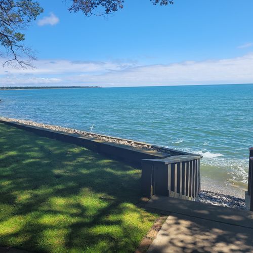Exterior:  another view of the private lakefront, highlighting the steps down to the water.