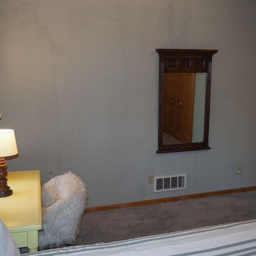 Bedroom #2 (second floor):  features a queen-size bed, desk with chair, mirror, and a large closet.