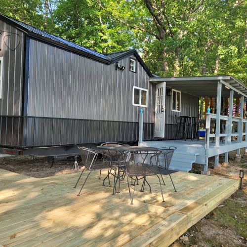 Exterior:  another view of the front of the house and the large deck.
