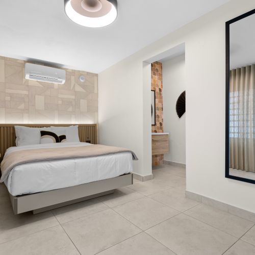 Modern room with a minimalist design, perfect for a relaxing stay.