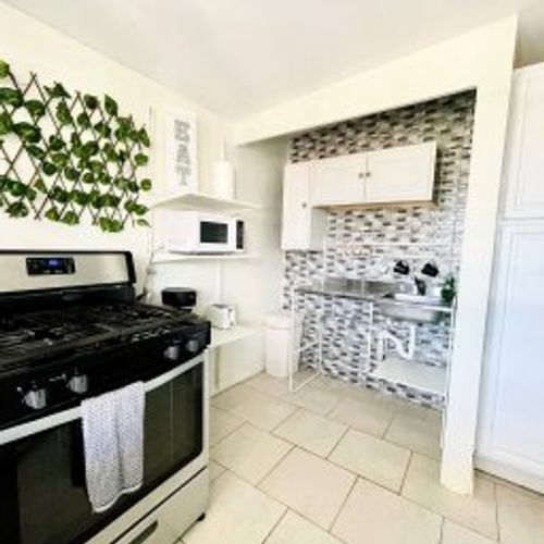 Prepare gourmet meals with ease in our fully equipped kitchen, featuring a modern oven, stove, and a spacious fridge to store all your ingredients.