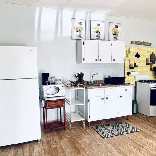 Whip up your favorite meals in our bright and fully equipped mini-kitchen, featuring a refrigerator, microwave, and stove for your culinary convenience