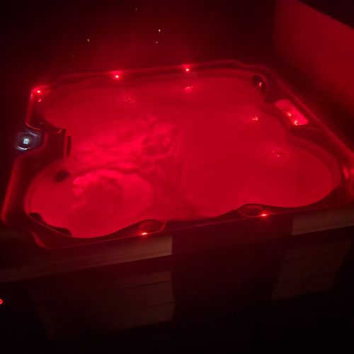 Exterior:  the hot tub can be easily changed to multiple different romantic colors at night.