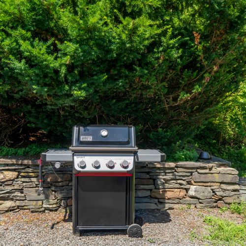 The grill is just off the kitchen, perfect for easy prep and enjoyment!