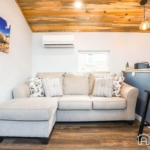 The couch is a comfy spot to relax and unwind.