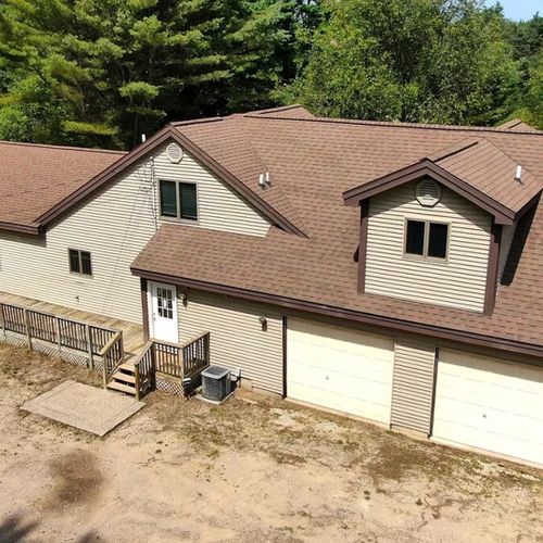 Exterior:  aerial photo highlighting the parking area and the 2-car garage, which is available for guests to use.
