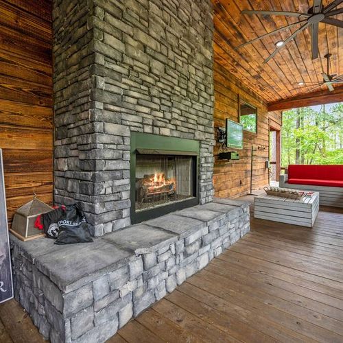 This floor to ceiling fireplace is the epitome of rustic luxury.