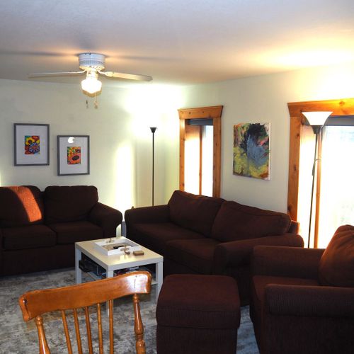 Living room:  super comfy with a sofa, loveseat, plush chair, coffee table, ceiling fan, and huge 55" live-streaming television with roku.