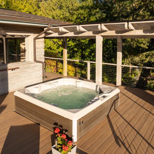 Relax in the hot tub while gazing at the harbor.