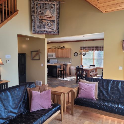 Living room:  gorgeous living room with 2 futons, an electric fireplace, and a lovely view of long lake!