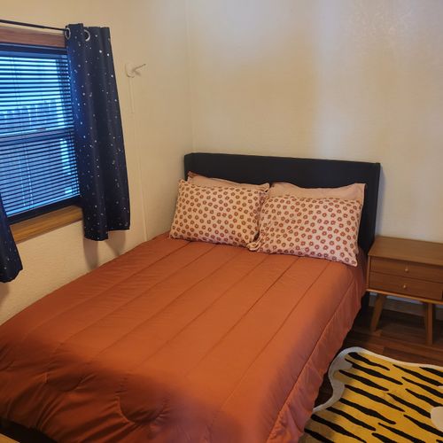 Bedroom #2:  the main floor's comfy cozy bedroom with a full-size bed.