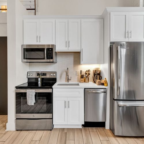 Cook like you're at home with stainless steel appliances, sleek cabinetry, and all the essentials right at your fingertips.