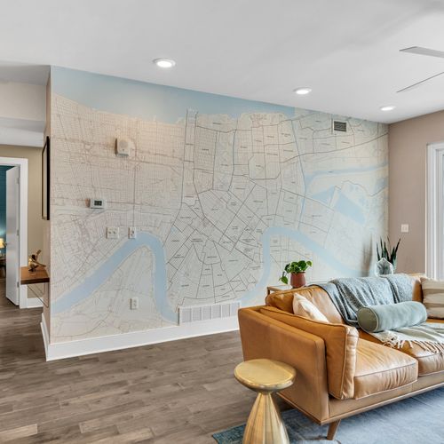 Chic seating area with a map of New Orleans as the perfect backdrop