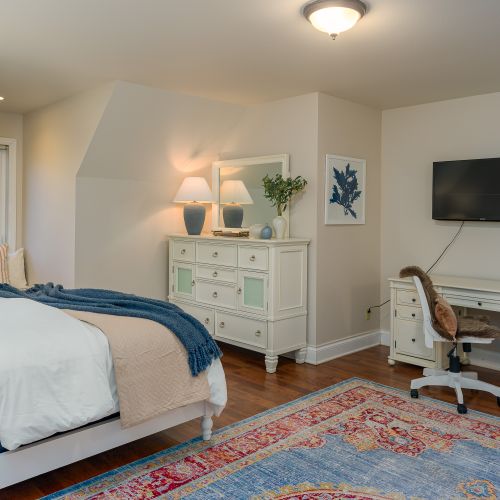 The Yoga Room is a large suite with views of the trees outside.  With a writer's desk and Smart TV, you can keep up with the world or not!