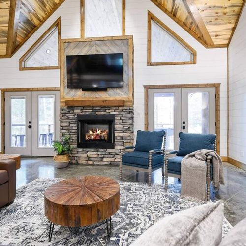 The heart of the living room is the stone fireplace and smart TV!