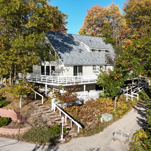 EXTERIOR:  The cottage sits up on the bluff overlooking Lake Michigan