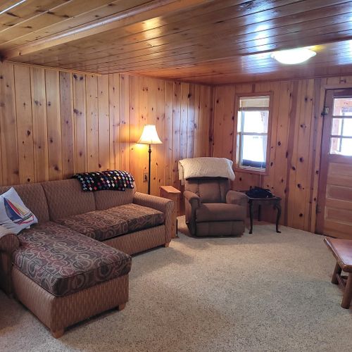 Living room:  very cozy and comfy living room with two sofas, two comfy chairs, a coffee table, and a gas fireplace.