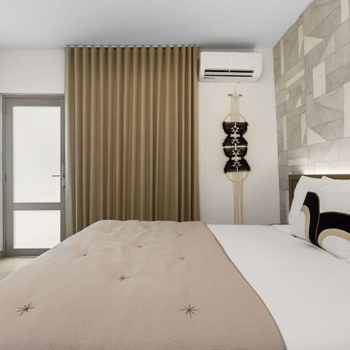 Spacious and serene bedroom, designed for ultimate rest.