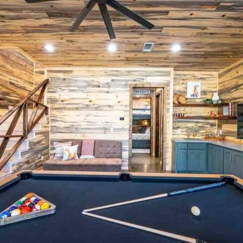 Pool table + A wet bar with a minifridge and smart tv!