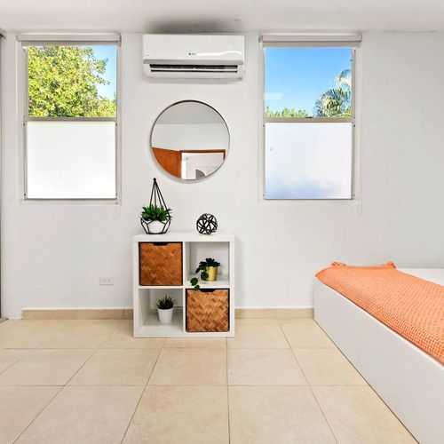Unwind in our stylish bedroom. The striking accent wall and comfortable bed provide a relaxing and visually pleasing space to recharge.