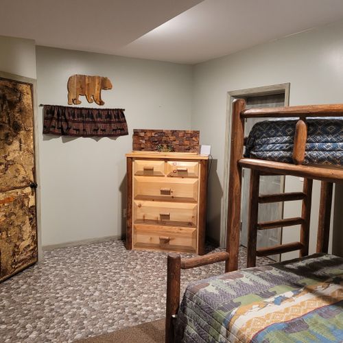 Bedroom #3 (first floor):  family-friendly first floor bedroom with a twin-on-queen bunk bed, closet, and dresser.