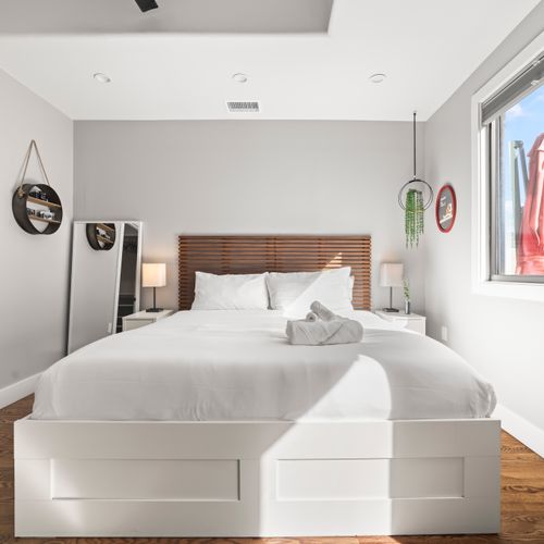 Primary bedroom with queen bed, fresh linens, and comfortable sleeping setup.