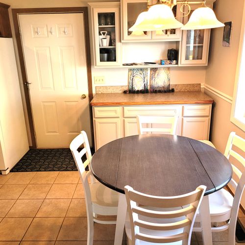 DINING AREA:  The home has a circular dining table with seating for up to 4 adults