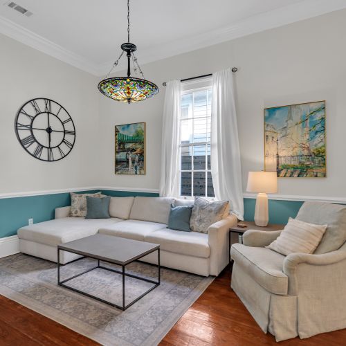 Bright sitting room w/ modern furnishings & plenty of natural light to start your day right.