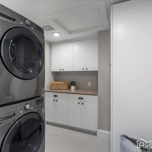 The large laundry room is fully equipped with all the necessities, making chores efficient and hassle-free.