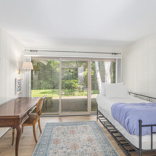 BEDROOM #4:  Features 2 twin beds.  (The desk in the photo has now been removed and replaced with a single bed.)