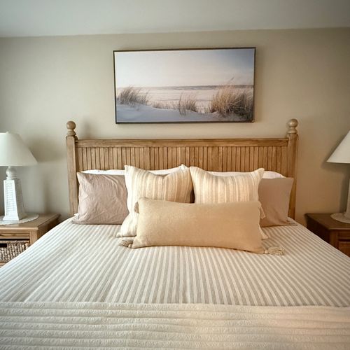Bedroom #1:  features a king-size bed, ceiling fan, private television and private en suite full bathroom!