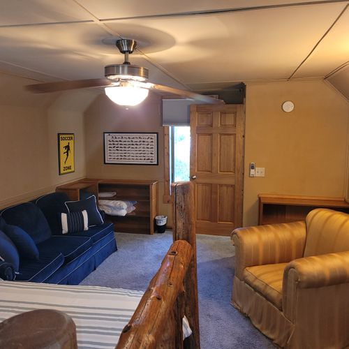 BEDROOM #3 (SECOND FLOOR):  Features a queen-size bed, comfy chair, sofa bed, baby crib, ceiling fan, dresser, and private live-streaming television.