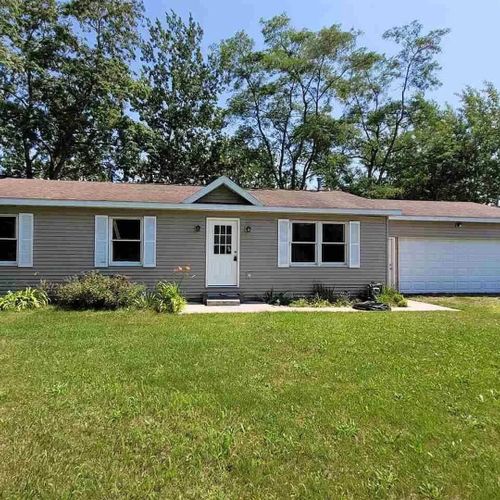 Overall:  the front of the home in summer.