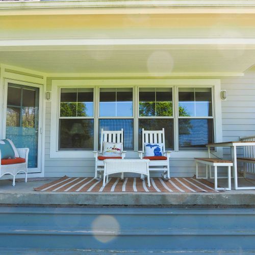 Exterior:  the home has a lovely back porch from which you can view the backyard, long lake, and sleeping bear dunes.