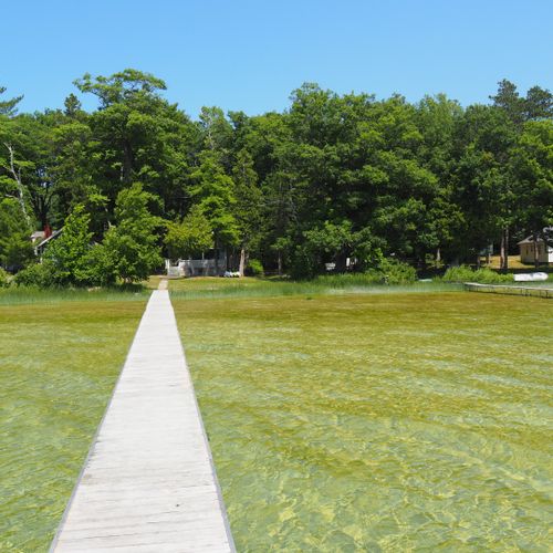 Exterior:  another view from the end of the dock looking back at the cottage.