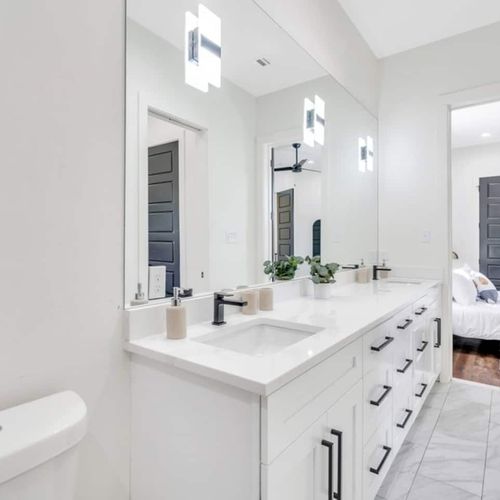 Upstairs Jack & Jill full bathroom w/ double vanity — bright, clean & shared w/ style.