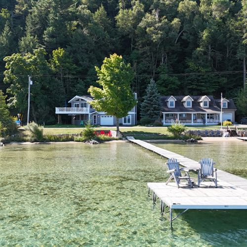 EXTERIOR:  Aerial view from just above the water highlighting the dock and the clarity of Crystal Lake
