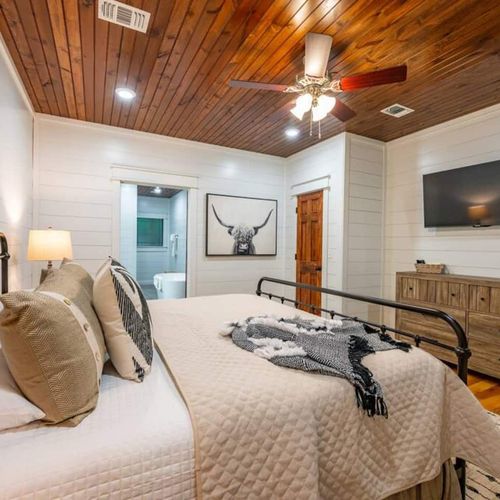 A smart tv and dresser are found in the suite for guest convenience!