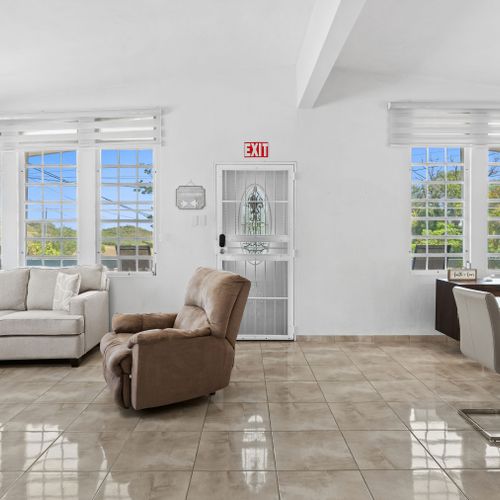 Kick back and relax: Bright living area with plenty of seating.